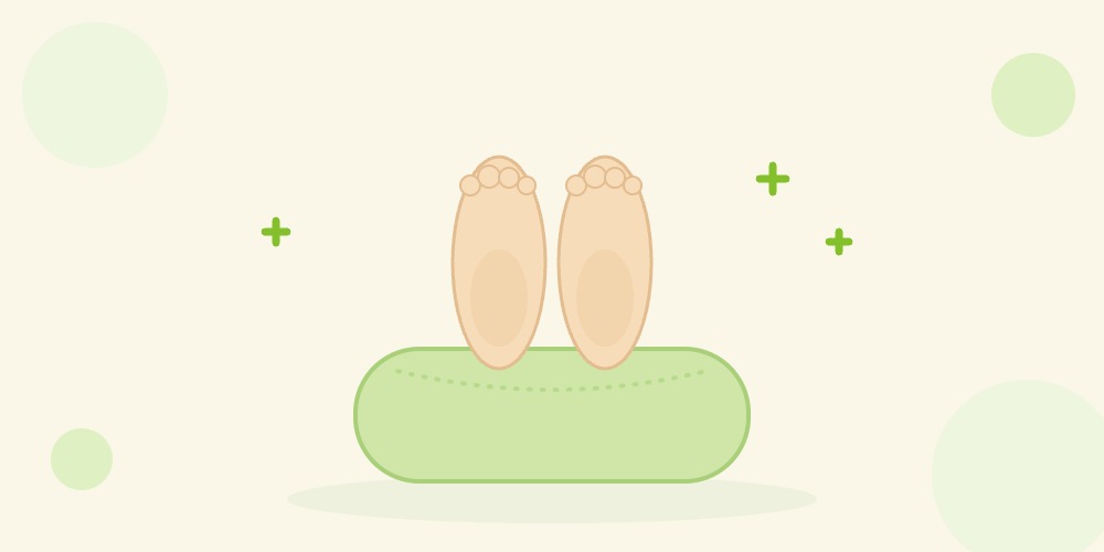 クッションの上に両足をのせて足を高くして休んでいるイラスト。